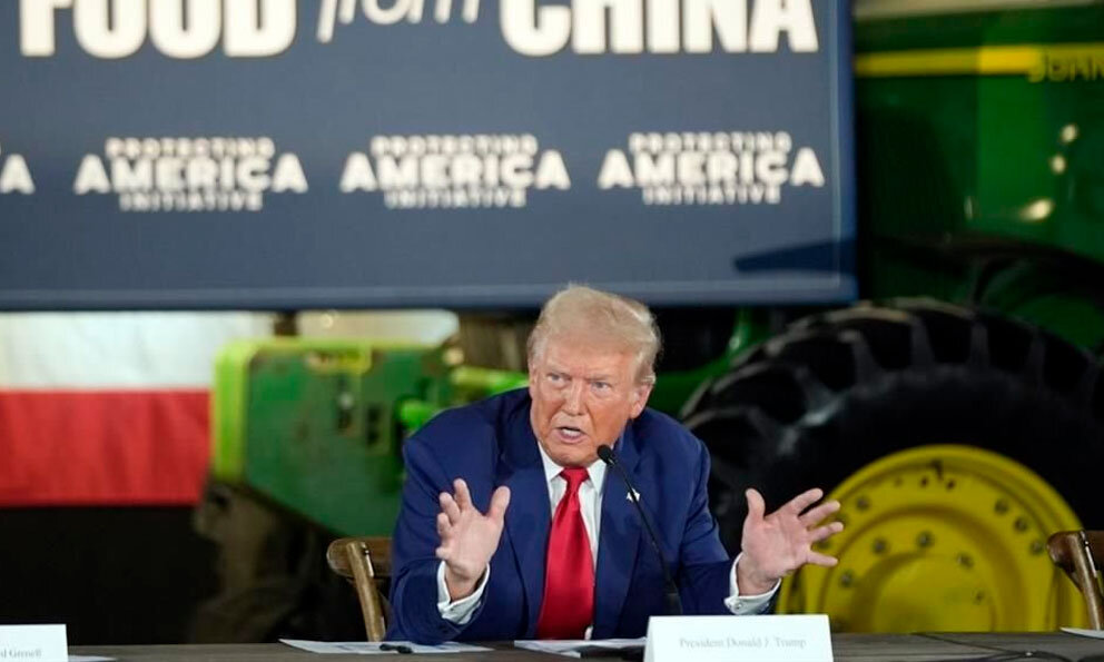 Trump speaks in front of John Deere tractor